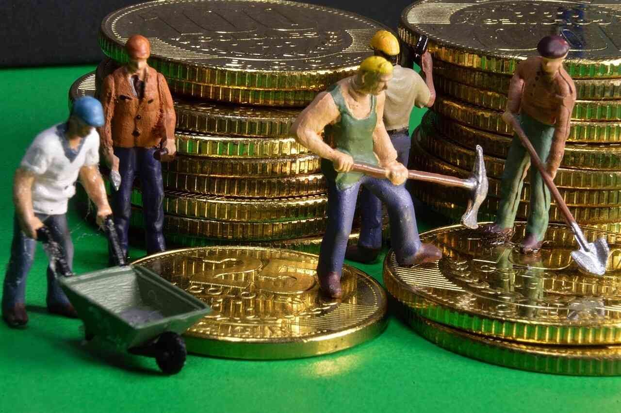 Miniature workers laboring around stacks of coins, symbolizing the hard work and effort involved in saving money, with tools like shovels and a wheelbarrow, representing the process of wealth accumulation, highlighting the psychology of saving money, patience, and disciplined financial planning."