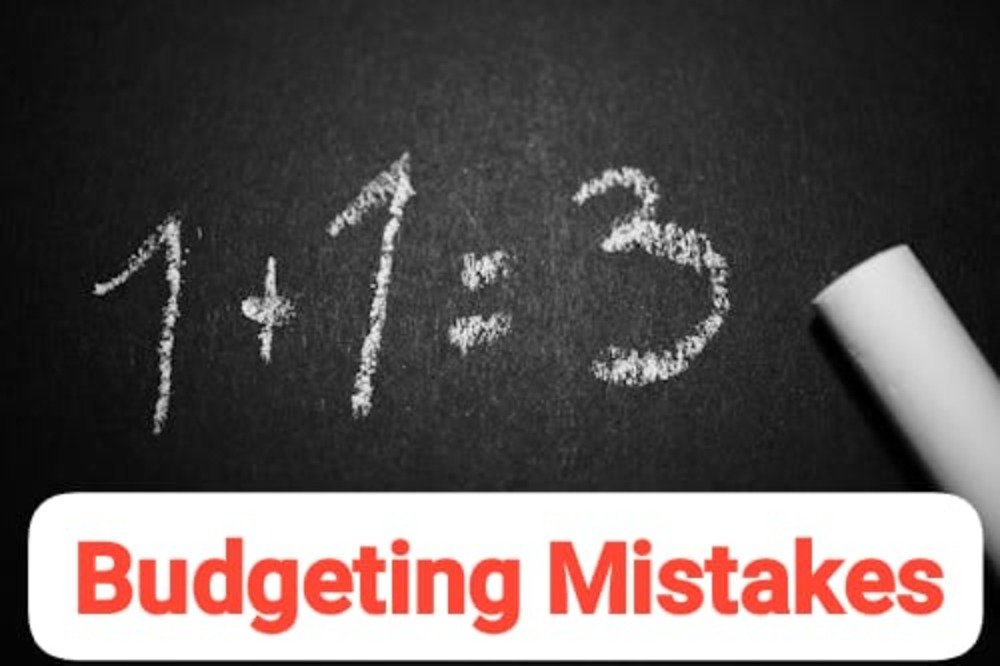 Chalkboard showing incorrect math equation 1+1=3 with chalk on the side, symbolizing common budgeting mistakes and financial miscalculations.