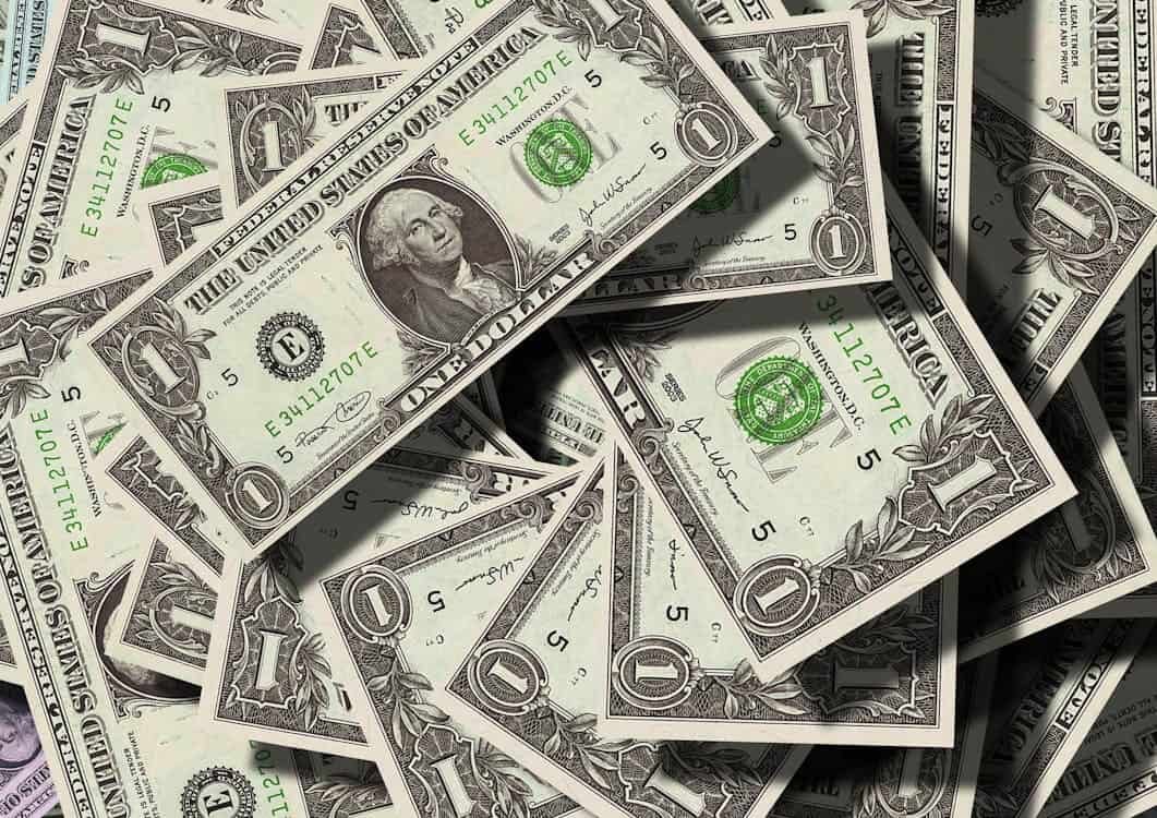Pile of U.S. one-dollar bills representing teen budgeting and money skills