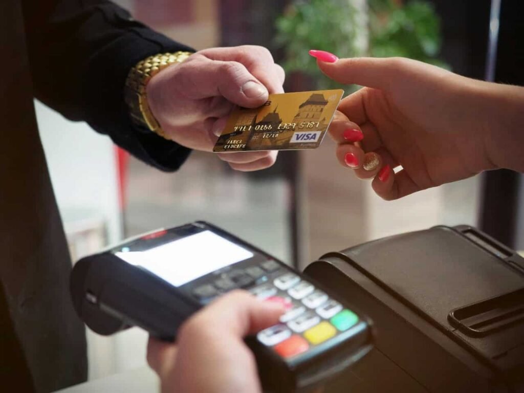 Close-up of a payment transaction with a credit card, representing everyday money management and responsible spending.