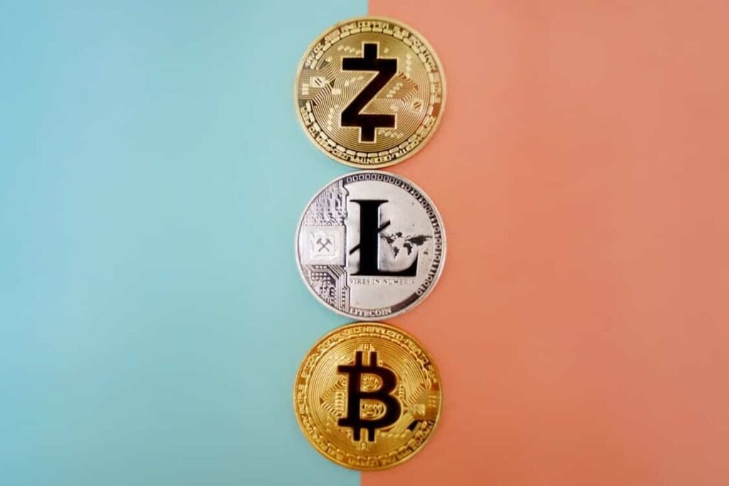 Cryptocurrency coins like Bitcoin and Litecoin symbolizing modern money ideas for teens learning about finance.