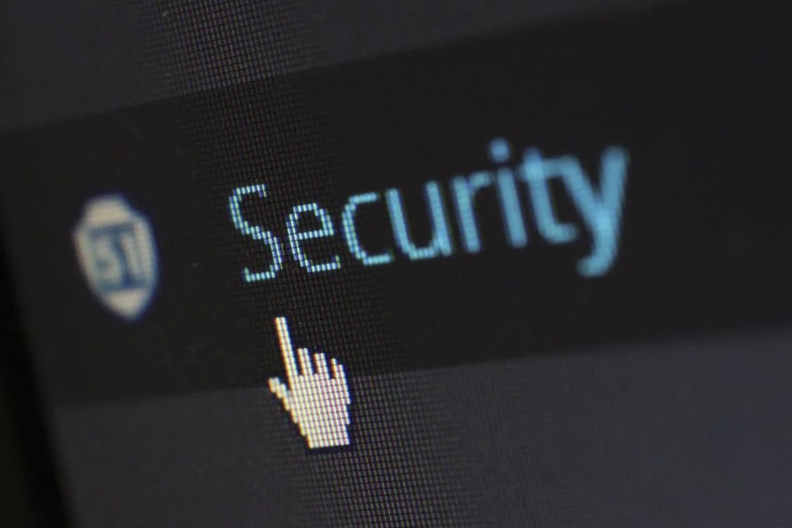 Realistic person using a laptop with a secure lock icon, symbolizing online privacy and data protection.