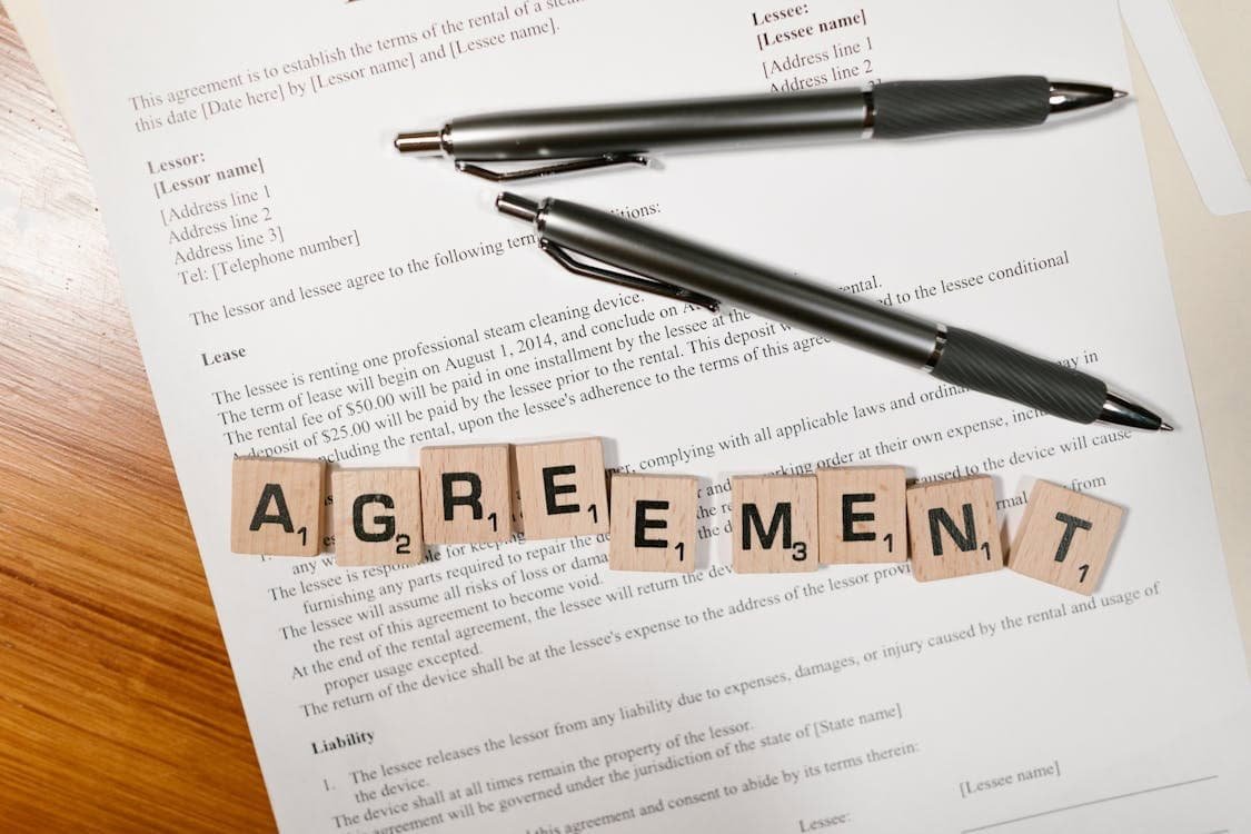 Realistic person reviewing terms and conditions on a digital device, ensuring informed agreement.