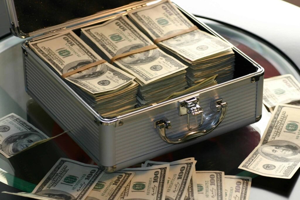 Visual representation of budgeting tips for teens leading to financial success, with a briefcase full of money symbolizing smart saving and money management