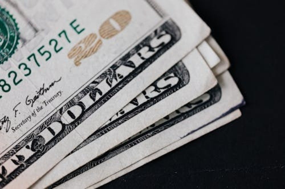 US dollar bills representing how international students make money in the USA.