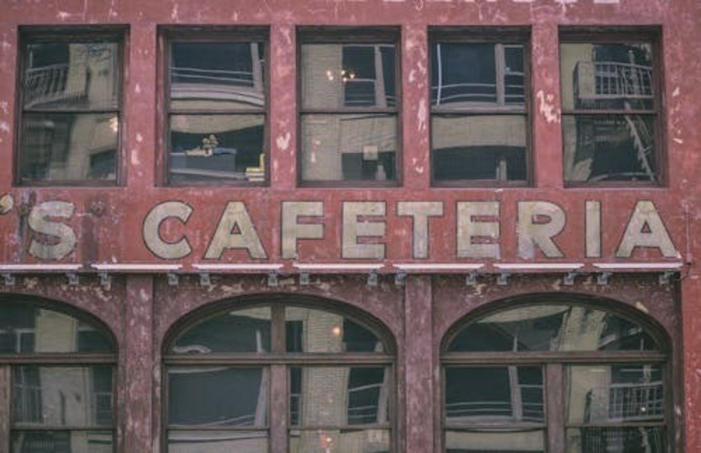 Old campus cafeteria building exterior representing college meal plan and dining hall options