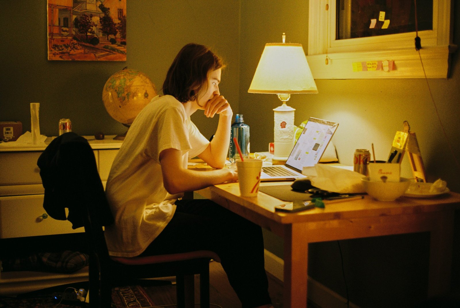 Student studying at night with laptop and planner — productivity tools, student planners, and dorm desk setup inspiration.