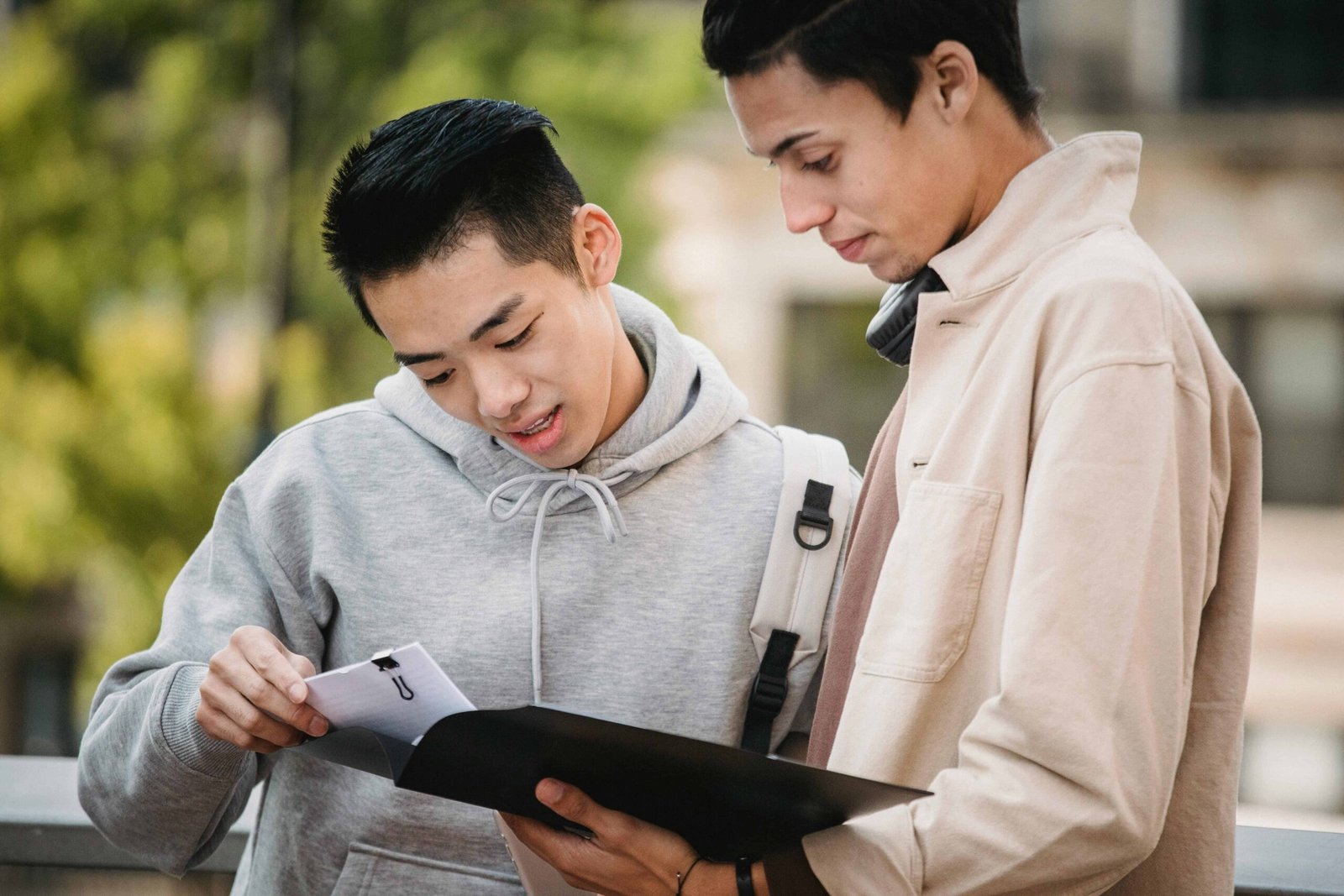 Students reviewing loan application documents together
